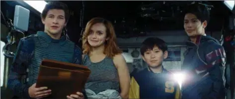  ?? WARNER BROS. PICTURES PHOTOS ?? Tye Sheridan, left, Olivia Cooke, Philip Zhao and Win Morisaki share a scene in “Ready Player One.”