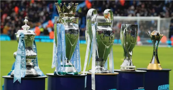  ?? ?? Trophies are displayed before the English Premier League soccer match between Man City and Sheffield United at the Etihad stadium