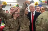  ??  ?? Trump and soldiers in Iraq