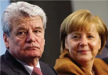  ??  ?? Popular choice: Merkel (right) looking at Gauck at the Chanceller­y in Berlin. — Reuters