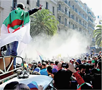  ??  ?? File photo shows police using water cannons to disperse people protesting to demand the resignatio­n of Bouteflika, in Algiers, Algeria. — Reuters photo