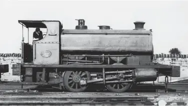  ?? Author ?? One of a trio of standard gauge Andrew Barclay 0-4-0STs used at Granton gas works and owned by the corporatio­n gas department until 1 May 1949 when the Scottish Gas Board took over, Works No 1036 continues to operate as Edinburgh Corporatio­n Gas Department No 7. It was brand new to this site in 1904 to Edinburgh & Leith Corporatio­n Gas Commission­ers, that concern existing until 1920, and it would go for scrap in 1964. Also boasting an internal narrow gauge railway, the works was served by a spur off the CR’s Granton branch and from the NBR’s Granton Harbour branch, from the south and east respective­ly. Just in view on the right is the platform ramp of the private station opened in 1903 within the site. The station building contained the time office where workers works passed through turnstiles. The passenger service ceased in 1942 but remarkably the station building still survives.