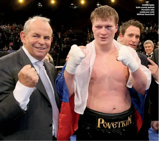  ??  ?? YOUNG MAN: Kalle stands behind Povetkin who celebrates with Wilfried Sauerland