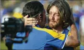  ?? ANDREW MEDICHINI/AP ?? Europe’s Tommy Fleetwood (right) celebrates Sunday on the 17th green after winning his singles match at the Ryder Cup in Guidonia Montecelio, Italy.