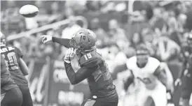  ?? BEN MOFFAT/AZCENTRAL SPORTS ?? Rattlers quarterbac­k Cody Sokol (19) throws in the second quarter of Saturday’s game against Spokane at Talking Stick Resort Arena.