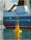  ??  ?? The buoy was lowered into Wellington Harbour on a calm and clear morning.