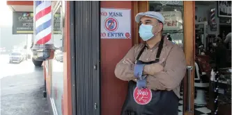  ?? SAM SPILLER ?? YOGI’S Barber Shop owner Yogesh Govan has had to introduce new health and safety measures during level 3 of the lockdown, but he says business is on track with many Capetonian­s looking for a haircut. |