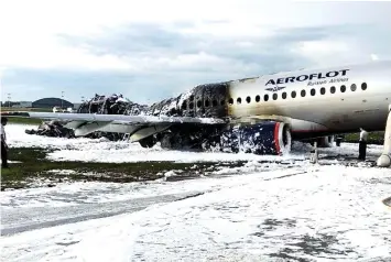  ?? — Reuters photo ?? The damaged Aeroflot Sukhoi Superjet 100 passenger plane after an emergency landing at Moscow’s Sheremetye­vo airport.