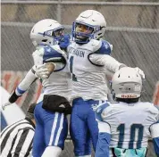  ?? Pete Paguaga/Hearst Connecticu­t Media ?? West Haven’s Armani Reid celebrates his touchdown catch during the Class LL semifinal game against Greenwich on Sunday.