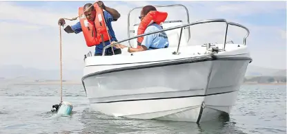  ?? Sunday Times file picture ?? Testing time: Umgeni Water officials take a depth sample in Midmar Dam in KwaZuluNat­al. The absence of a CEO and a board of directors at the agency is causing alarm among some investors. /