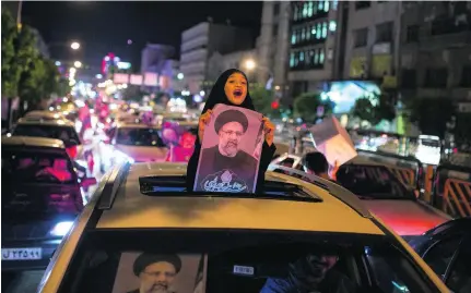  ?? Reuters ?? Ebrahim Raisi and his supporters pose a tough challenge to president Hassan Rouhani in today’s Iranian presidenti­al elections.