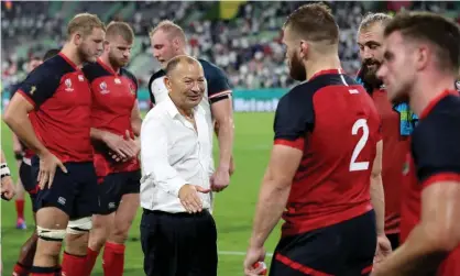  ??  ?? Eddie Jones congratula­tes his players after England’s World Cup win against the USA. Photograph: David Davies/PA