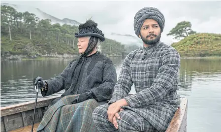  ??  ?? Judi Dench and Ali Fazal in a scene from Victoria And Abdul.