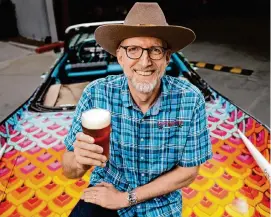  ?? Yi-Chin Lee/Staff photograph­er ?? Brock Wagner, co-founder of St. Arnold Brewing Company, is all smiles on a
St. Arnold art car on April 9. Wagner was grand marshal of the parade this year.