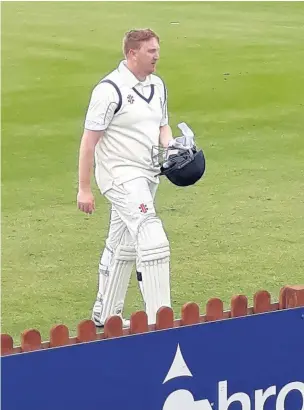  ??  ?? ●●Adam Wilde heads to the pavilion after his fine knock of 96
