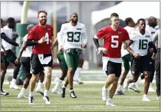  ?? ADAM HUNGER - THE ASSOCIATED PRESS ?? New York Jets quarterbac­ks James Morgan
(4) and Mike White (5) warm up during NFL football practice Wednesday,
July 28, 2021, in Florham Park, N.J.