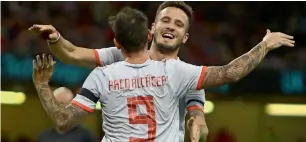  ?? — AFP ?? Spain’s Paco Alcacer (left) celebrates scoring his team’s third goal.