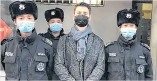  ?? PHOTO COURTESY MITCHELL HIBBERT ?? Mitchell Hibbert must don a surgical mask when he leaves his dorm at East China Normal University in Shanghai.