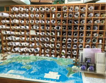  ??  ?? A wall stacked with charts awaits at shops such as Seabreeze Nautical Books and Charts in San Diego.