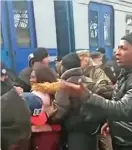  ?? ?? Africans are seen in train queues as they try to evacuate Ukraine amid reports that they were being denied passage.