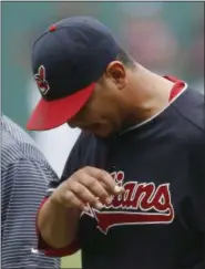  ?? RON SCHWANE — THE ASSOCIATED PRESS ?? Indians pitcher Carlos Carrasco walks off the field after suffering a broken finger when he was hit by a ball off the bat of the Tigers’ Ian Kinsler on Sept. 17 at Progressiv­e Field.