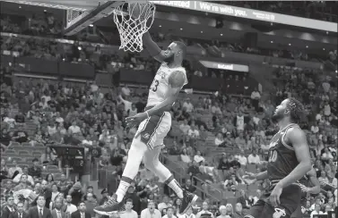  ?? STEVE MITCHELL / USA TODAY SPORTS ?? LeBron James of the Los Angeles Lakers dunks as Justise Winslow of the Miami Heat can only watch during Sunday’s NBA game at American Airlines Arena in Miami. James had 51 points to lead the Lakers to a 113-97 victory.