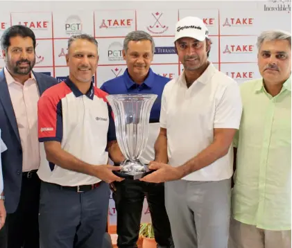  ??  ?? Indian golfing legends Jeev Milkha Singh (second from left) and Jyoti Randhawa pose with the TAKE Open trophy in Chandigarh on Tuesday.