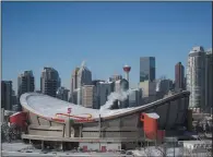  ?? CP PHOTO JEFF MCINTOSH ?? Steam rises from buildings near the Scotiabank Saddledome in Calgary, Alta., Wednesday, Feb. 8, 2017. The Calgary Flames have cancelled plans to build a new arena.