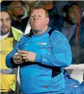  ??  ?? Sutton United substitute goalkeeper Wayne Shaw chomps on a pie during the non-league team’s FA Cup loss to Arsenal.