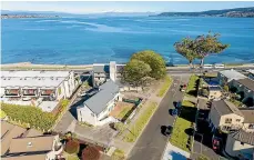  ?? ?? The high profile lakefront Tui Oaks Motel Taupo is located on the corner of Tui St and Lake Tce on a 2008-sqm metre landholdin­g.