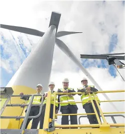  ??  ?? ORE Catapult’s sector lead for wind, Cian Conroy, strategy and commercial­isation director Dr Stephen Wyatt, Scottish Energy Minister Paul Wheelhouse and ORE Catapult operations director Tony Quinn on the platform of the Levenmouth Demonstrat­ion Turbine.