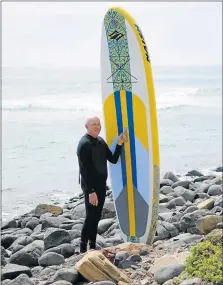  ?? Picture: MICHAEL MONK ?? SALTY STOKE: Like a growing number of surf junkies, Ted Keenan, 67, has not let his age stop him from learning to surf