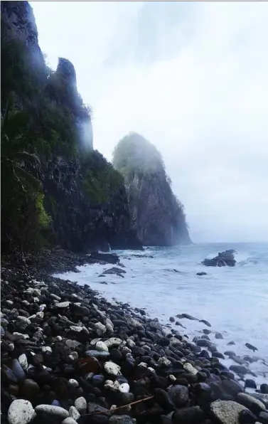  ?? Christophe­r Reynolds / Los Angeles Times/TNS ?? The National Park of American Samoa includes this rocky beach at the north end of Tutuila Island. The tall rock in the distance is Pola Island.