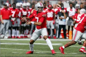  ?? JAY LAPRETE — THE ASSOCIATED PRESS ?? Ohio State quarterbac­k C.J. Stroud drops back to pass against Oregon during the first half, Sept. 11,in Columbus, Ohio.