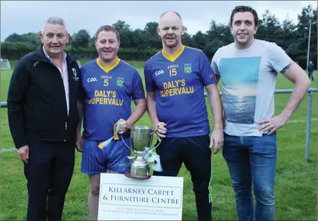  ??  ?? Tim Ryan presenting the O’Sullivan Cup to Spa captain Paul Russell and vice-captain Conor Gleeson, with Niall O’Sullivan