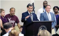  ??  ?? LOS ANGELES: California Attorney General Xavier Becerra (center) answers questions after a news conference. Democrats in California, New York and other states are trying to intervene in a federal lawsuit that threatens to undercut funding for the...