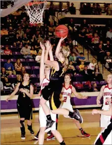  ?? PHOTO COURTESY OF SHELLEY WILLIAMS ?? Prairie Grove junior Taylor Hartin sails in for a layup during the Lady Tigers’ 46-37 State 4A quarterfin­al victory against Brookland on Sunday. The game was reschedule­d from Friday. Hartin scored 10 combining with her twin sister, Mattie, for 25 points.