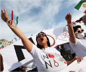  ?? (Yves Herman/Reuters) ?? MEMBERS OF the Iranian diaspora in Europe take part in a rally in Brussels last September, marking the first anniversar­y of the death of Mahsa Amini.