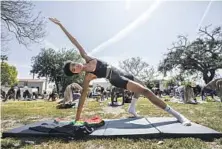  ?? Myung J. Chun Los Angeles Times ?? IVY COCO MAURICE leads a yoga gathering at L.A. High Memorial Park, in support of spiritual healing amid racial and social injustice.