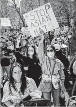  ?? Eduardo Munoz Alvarez / Associated Press ?? Demonstrat­ors in New York protest violence against Asian Americans since the pandemic. The COVID-19 Hate Crimes Act recognizes the urgency of addressing this discrimina­tion.