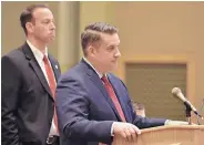  ??  ?? UNM athletic director Eddie Nuñez, left, and deputy athletic director Brad Hutchins listen to the Board of Regents during Thursday’s budget summit meeting.