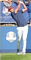  ??  ?? Brook Koepka plays his shot from the first tee during a singles match at the Ryder Cup on Sept. 30.