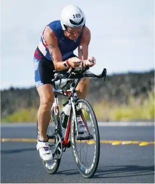  ??  ?? ABOVE Bob Knuckey at the Ironman World Championsh­ip in 2018