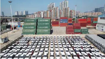  ?? — Reuters ?? Cars wait for export at a port in Dalian, Liaoning province, China.