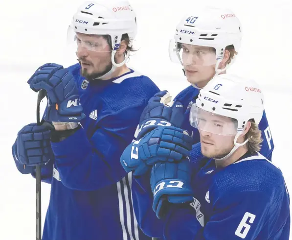  ?? DARRYL DYCK/THE CANADIAN PRESS ?? Winger J.T. Miller, left, will be reunited with Elias Pettersson and Brock Boeser on the Vancouver Canucks' top line now that he is out of quarantine and has been clear to resume play after a possible exposure to COVID-19 from teammate Jordie Benn.