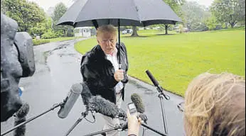  ?? AP ?? Donald Trump talks to reporters outside the White House on Monday.
