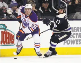  ?? Paul Vernon / Associated Press ?? Oilers forward Connor McDavid (left) leads the NHL in scoring with 50 points, ahead of Sidney Crosby, Evgeni Malkin, Patrick Kane and Brent Burns.