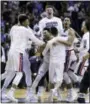  ?? BEN MARGOT — THE ASSOCIATED PRESS ?? Gonzaga players celebrate after beating West Virginia on Thursday.