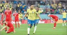  ?? (AFP) ?? Brazil’s midfielder Casemiro (L) celebrates with Brazil’s forward Vinicius Junior scoring against Switzerlan­d during the FIFA World Cup Qatar 2022 Group G match at Stadium 974 in Doha on Monday.