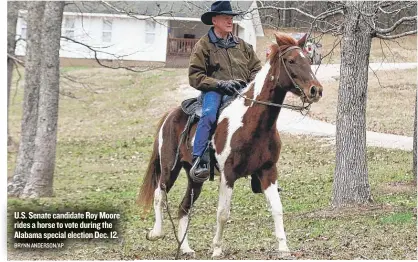  ?? BRYNN ANDERSON/ AP ?? U. S. Senate candidate Roy Moore rides a horse to vote during the Alabama special election Dec. 12.